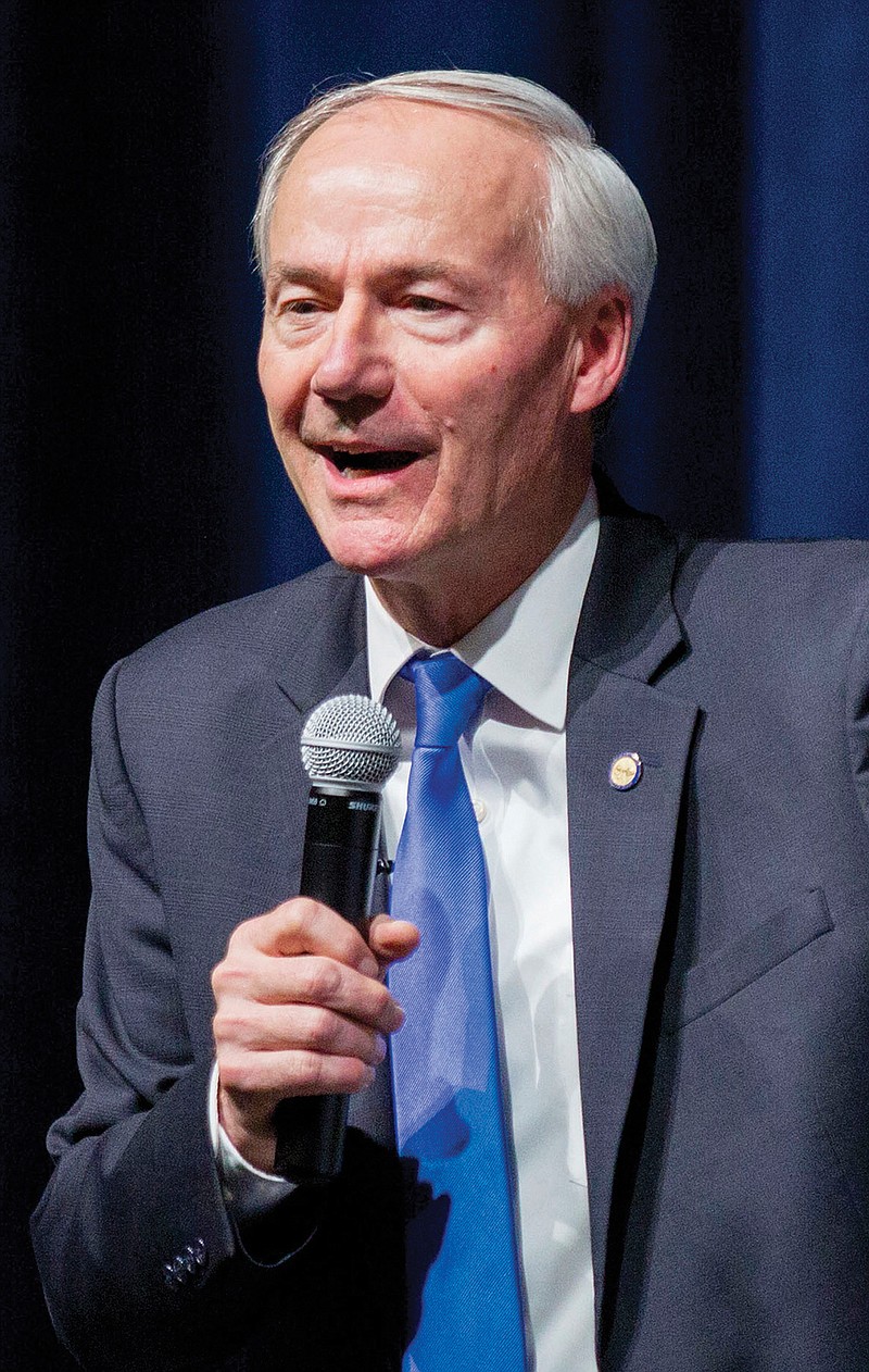 In this March 22, 2016 photo, Arkansas Gov. Asa Hutchinson speaks in Conway, Ark. Arkansas lawmakers have approved a plan to preserve the state's first-in-the-nation hybrid Medicaid expansion, backing an unusual tactic that will require a veto from Republican Gov. Asa Hutchinson to save the program covering more than 250,000 poor people. The House on Thursday April 21, 2016 voted 76-13 for a Medicaid budget bill that sets a Dec. 31 end date for the program. Hutchinson then will veto the end date, effectively preserving the program. 