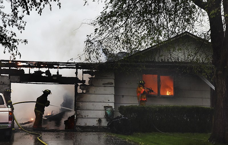 Cole County Fire Protection District firefighters responded to a structure fire at 2205 S. Country Club Drive. during the height of Tuesdayâ€™s rain and wind onslaught.