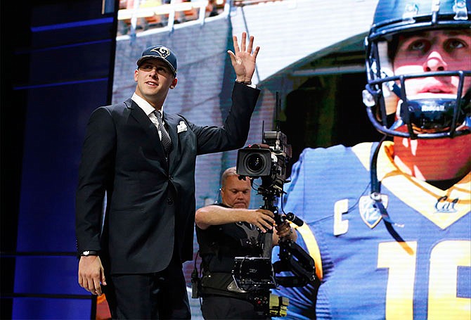 Californiaâ€™s Jared Goff waves as after being selected by the Los Angeles Rams as 1st pick in the first round of the 2016 NFL football draft, Thursday, April 28, 2016, in Chicago.