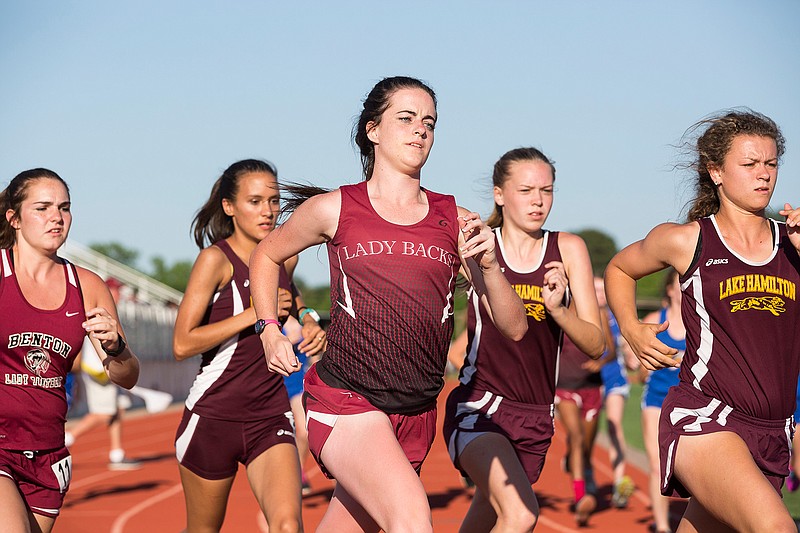 Arkansas High School's Emily Griffis, center, starts the 1,600-meter race in the finals of the Conference 6A-South track and field meet Thursday, April 28, 2016 at Arkansas High School. Griffis placed sixth.