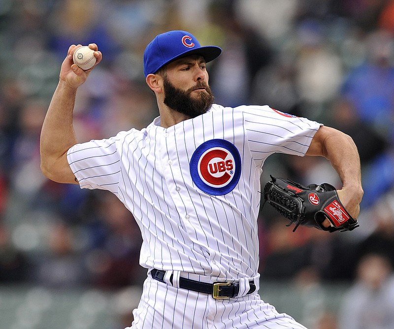 Chicago Cubs starter Jake Arrieta delivers a pitch during the first inning of a baseball game against the Milwaukee Brewers Thursday, April 28, 2016, in Chicago.