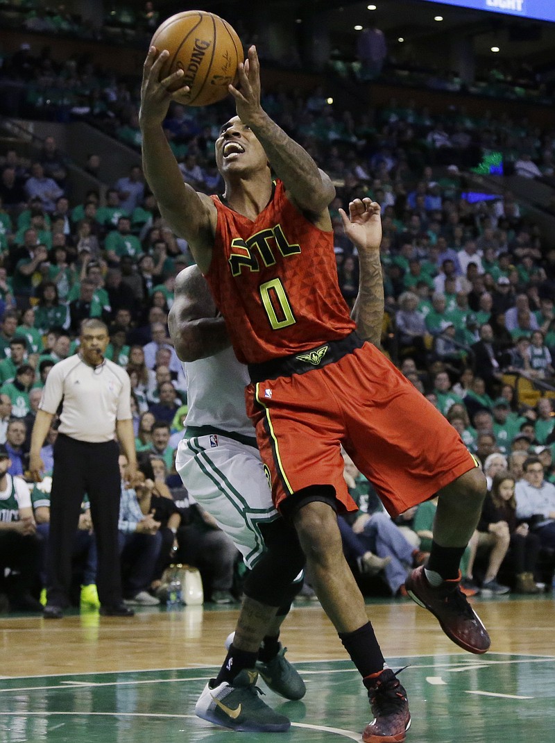 Atlanta Hawks guard Jeff Teague (0) drives to the hoop during the third quarter against the Boston Celtics in Game 6 of a first-round NBA basketball playoff series Thursday, April 28, 2016, in Boston. The Hawks won 104-92 to win the series 4-2. 