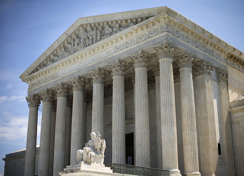 In this June 30, 2014 file photo, the Supreme Court building is seen in Washington. The Supreme Court on Friday, April 29, 2016, rejected an emergency appeal to stop Texas from enforcing its challenged voter ID law. But the court said it could revisit the issue as the November elections approach. 
