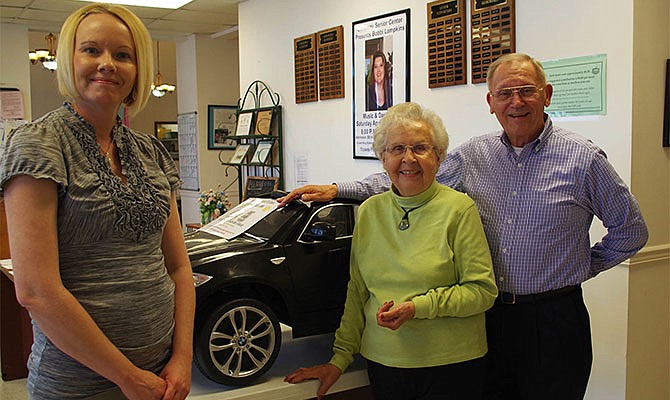 Amanda Young, administrator of the Callaway Senior Center, receives a black BMW to be raffled as a fundraiser. The drivable toy car was donated to the center by members of Prairie Chapel United Methodist Church at County Road 227, according to member Bev Gray. Also shown are church members Nancy Rice and Rick Matson.