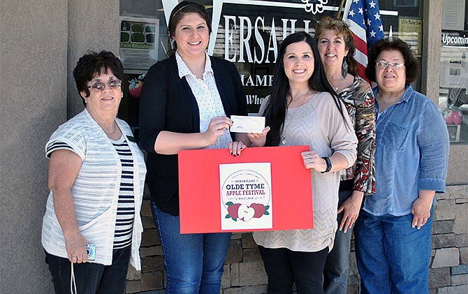 Pictured at the 2016 Olde Tyme Apple Festival Logo Contest winner presentation are, from left, Versailles Chamber Board Member Linda Appleton, contest first place winner Shelby Patterson, Versailles Chamber President
Deanna Lucas, chamber member and Footprints on the Heart owner Shelby Wheatly and Chamber Office Manager
Mignon Dureka.