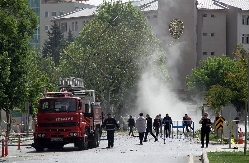 Emergency personnel converge on the scene of a car bombing in Turkey.