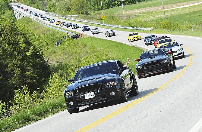 Kyle Caraway leads a parade of 66 vehicles, mostly Mustangs, last year on Route B through Cole County on their way to St. Thomas, Meta and Westphalia before returning to Jefferson City. Last year's Country Cruise was so popular, they added a second one for the 10th anniversary gathering.