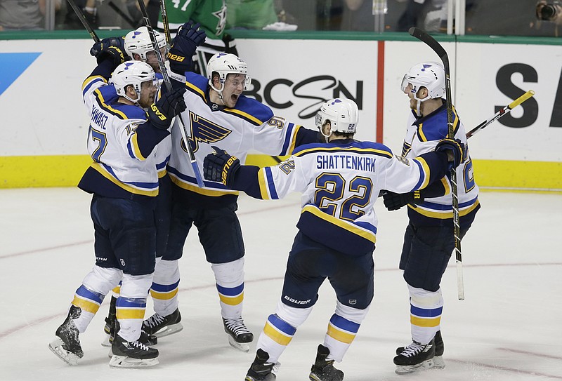 Members of the St. Louis Blues celebrate Sunday after winning Game 2 of the Western Conference semifinals against the Stars in Dallas.