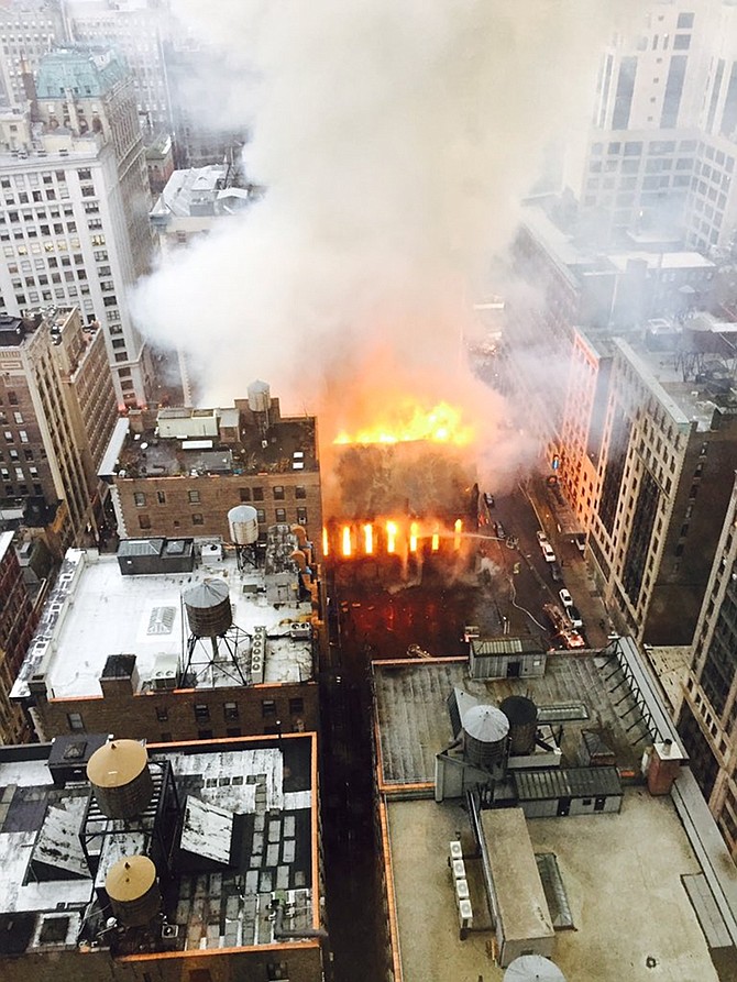 Firefighters battle flames at an historic Serbian Orthodox Cathedral of St. Sava on Sunday in New York. The church was constructed in the early 1850s and was designated a New York City landmark in 1968.