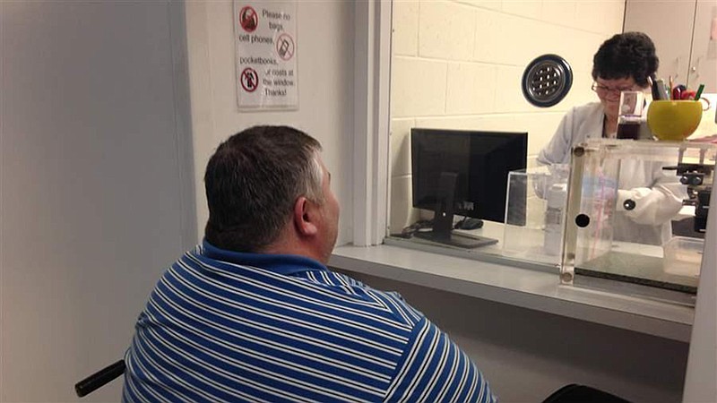 A patient gets a dose of the anti-addiction medicine buprenorphine at the Broadway Center for Addiction in Baltimore, whose treatment methods for opioid addiction are viewed as a model for other clinics. 