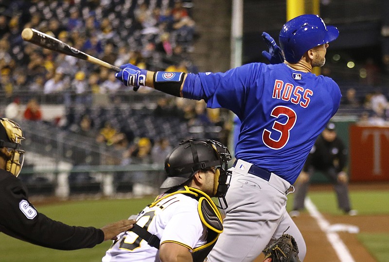 Chicago Cubs' David Ross drives in two runs with a hit against the Pittsburgh Pirates during the fifth inning Monday in Pittsburgh.