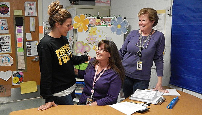 Teachers Megan Metz (left), Linda Williams and Marla Reynolds share a laugh on Tuesday, celebrated as National Teacher Appreciation Day. All three teach reading at McIntire Elementary School in Fulton.