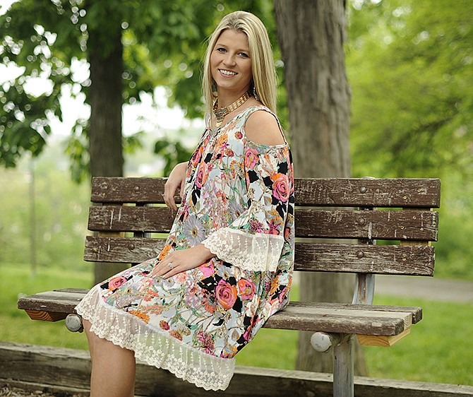 Terra McClanahan, of Jefferson City, wears a cold-shoulder, bohemian chic dress and choker necklace from Saffees. This summerâ€™s fashions pay tribute to the 1970s, with cut-outs, bold patterns and lace, said Saffees owner Judy Howard.