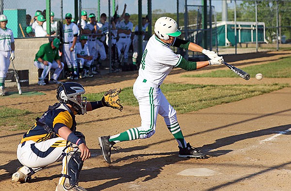 Ryan Paschal of Blair Oaks singles up the middle in the fifth inning of a game on Tuesday, May 3, 2016, against Battle in Wardsville, Mo.
