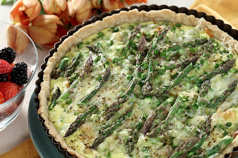 A spring tart for Mother's Day is filled with asparagus, peas and leeks, all held together with a light custard. 