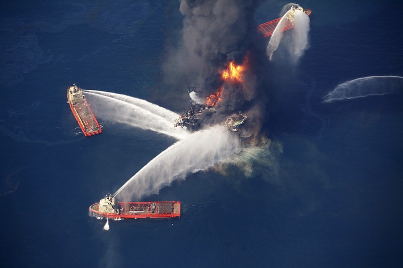 In this April 21, 2010, file photo, the Deepwater Horizon oil rig burns in the Gulf of Mexico following an explosion that killed 11 workers and caused the worst offshore oil spill in the nation's history. A federal judge in New Orleans granted final approval on Monday, April 4, 2016, to an estimated $20 billion settlement, resolving years of litigation over the spill. 