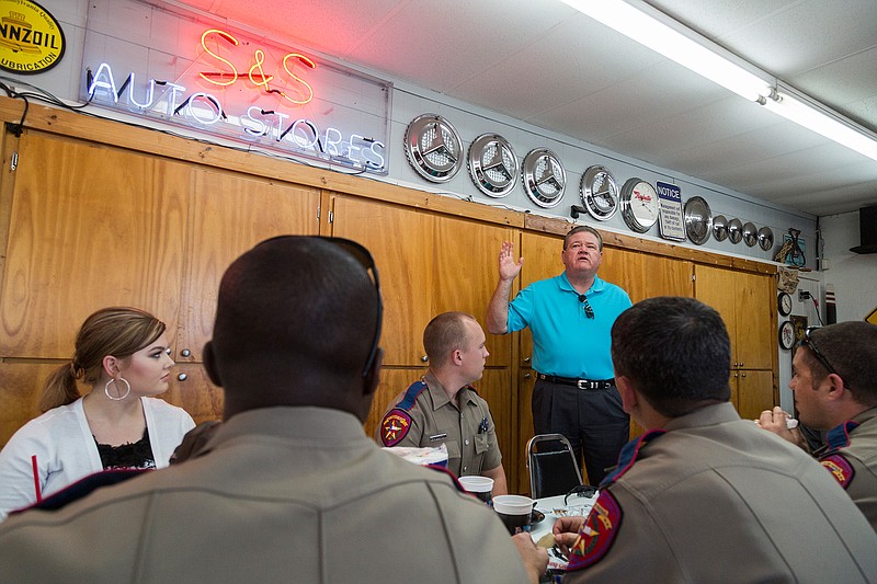 Danny Proctor thanks area police officers for their work in the community Thursday, May 5, 2016 at his and Dave Roberts' garage on Seventh Street in Texarkana. Proctor said he recognized the difficulty of their job and hoped a barbecue lunch would show his appreciation. 
