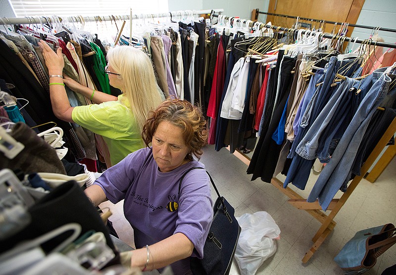 Debbie Owens and others look through donated clothes Thursday, May 5, 2016 at First United Methodist Church in Texarkana, Texas. Eleven female clients of Randy Sams' Outreach Shelter were treated to a spa day. 
