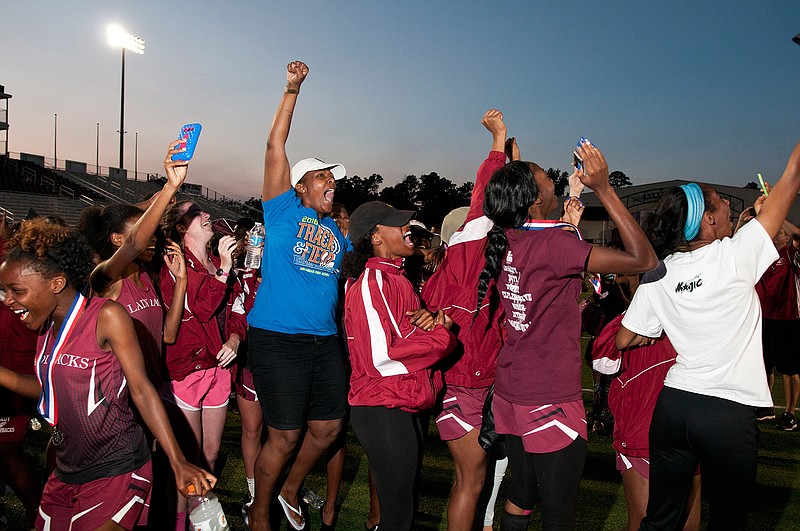 Arkansas High Track and Field teams celebrate after being crowned state champions at the Class 6A State Track and Field Meet on Thursday, May 5, 2016 in Benton, Ark. 