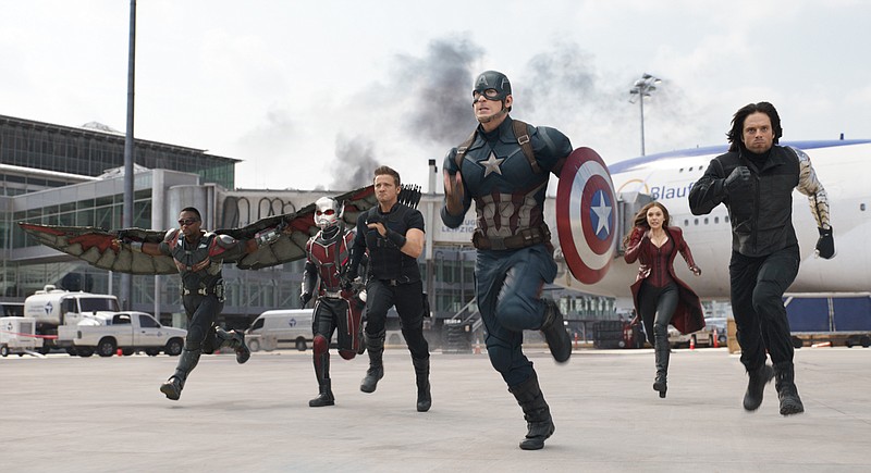 In this image released by Disney, Anthony Mackie, from left,  Paul Rudd, Jeremy Renner, Chris Evans, Elizabeth Olsen and Sebastian Stan appear in a scene from "Captain America: Civil War."