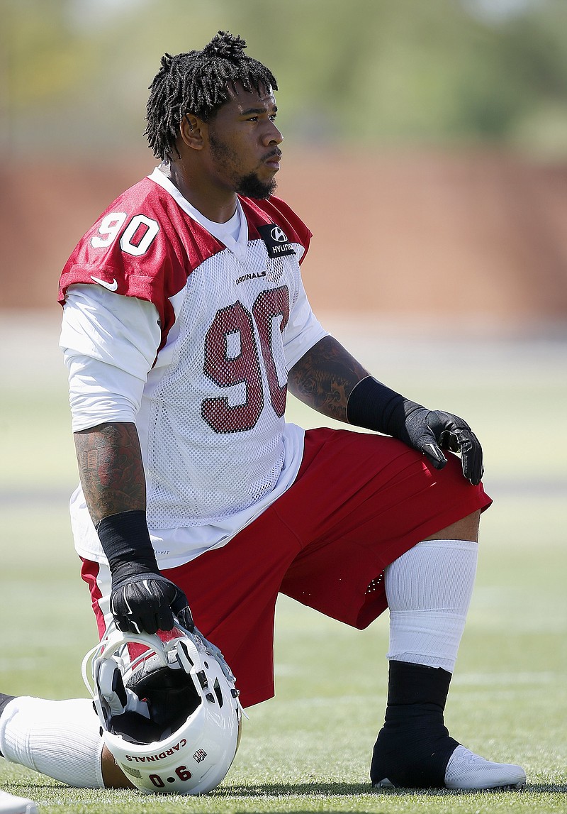 Arizona Cardinals defensive tackle Robert Nkemdiche (90), a first round draft pick from Mississippi, takes a break during the team's NFL football rookie camp practice Friday, May 6, 2016, in Tempe, Ariz.