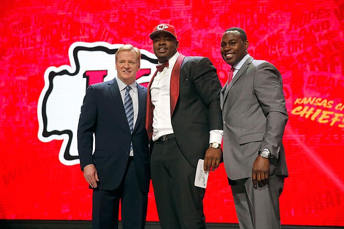Mississippi State's Chris Jones poses for photos with NFL Commissioner Roger Goodell, left, and former NFL player Tony Richardson after being selected by Kansas City Chiefs as 37th pick in the second round of the 2016 NFL football draft, Friday, April 29, 2016, in Chicago.