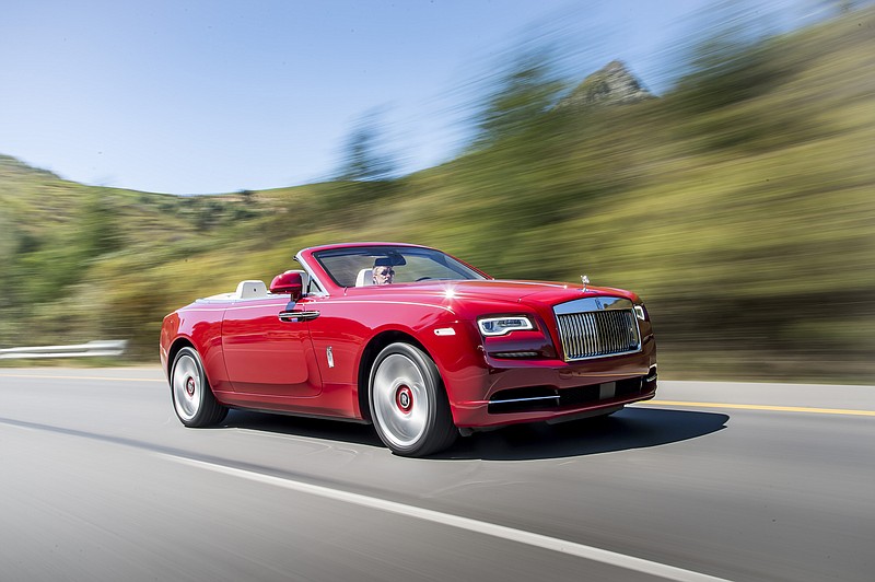 The $400,000 Rolls-Royce Dawn convertible is shown.