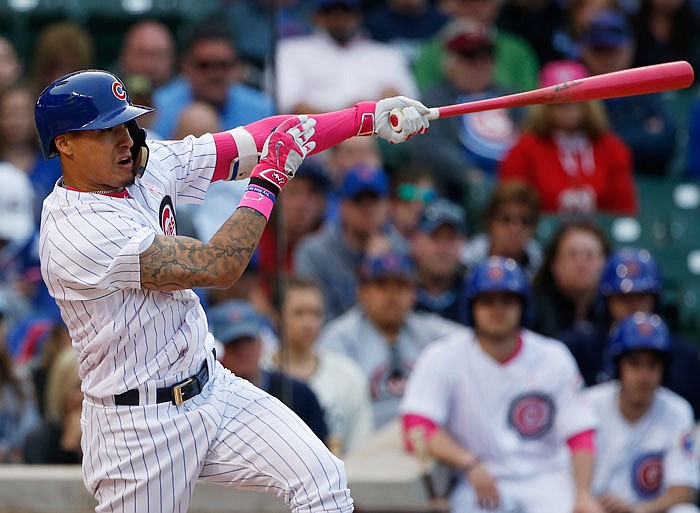 Chicago Cubs' Javier Baez hits the game-winning solo home run against the Washington Nationals during the 13th inning of a baseball game Sunday, May 8, 2016, in Chicago. The Cubs won 4-3. 