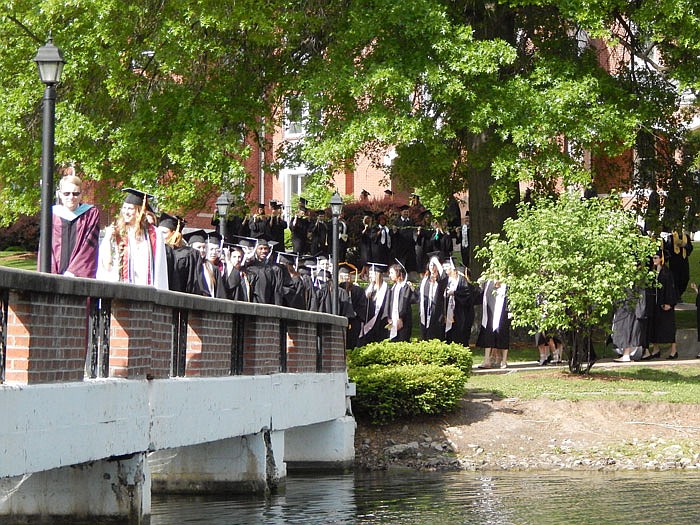 William Woods University graduates participated in the school's traditional Ivy Ceremony on Saturday morning, May 7, 2016, walking across the bridge over Senior Lake on the Fulton campus.