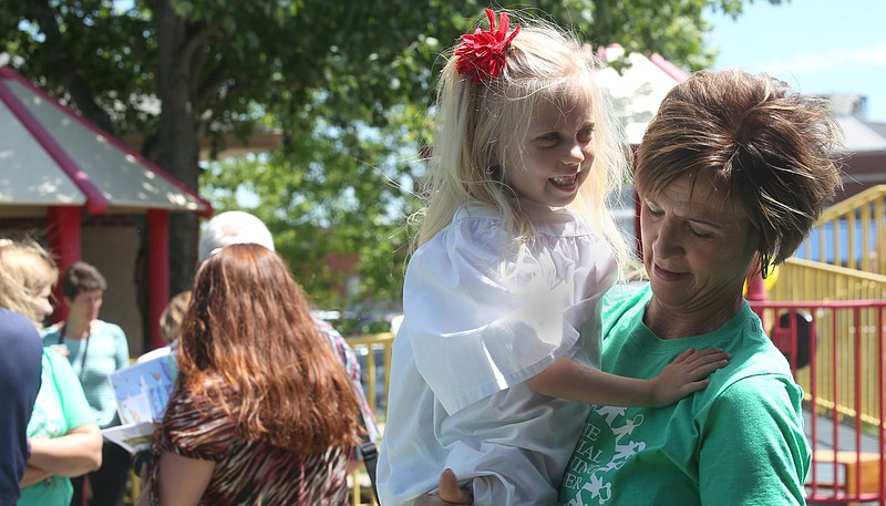 Physical Therapist Mary Owens holds graduate Gracie Meyer, 4, Thursday at the Special Learning Center in Jefferson City. Owens has known Meyer since she was a baby at the Special Learning Center.