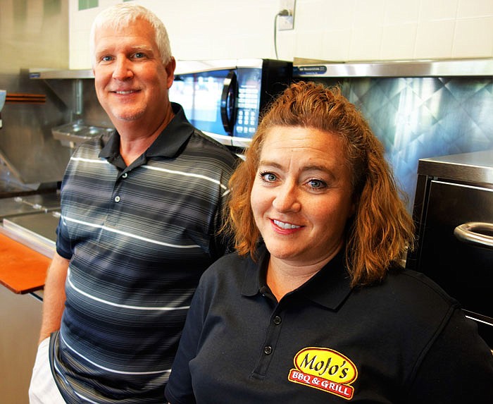 Retired police officers Earl and Alison Freeland are the owners and managers of MoJo's BBQ and Grill opening in June in Fulton, Mo.