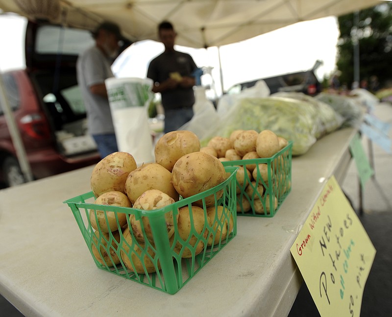 In this May 2016 photo, two pints of Yukon gold new potatoes were all that was left of James Hohman's available potatoes as he sold produce from his stand during the Cole County Farmers Market.