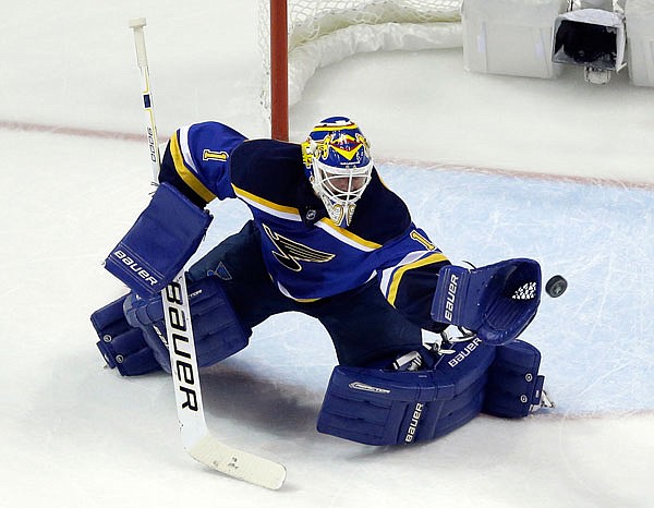 Blues goalie Brian Elliott makes the save during the second period of Tuesday night's Western Conference finals game with the Sharks in St. Louis.