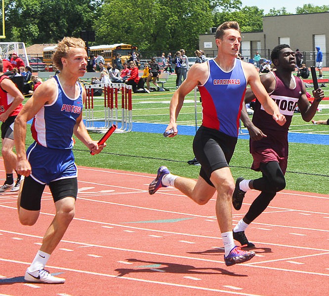California's Cory Friedmeyer looks to hand off the baton in the 4 x 200 Relay on Saturday in the Class 3 District 7 meet in Clinton.