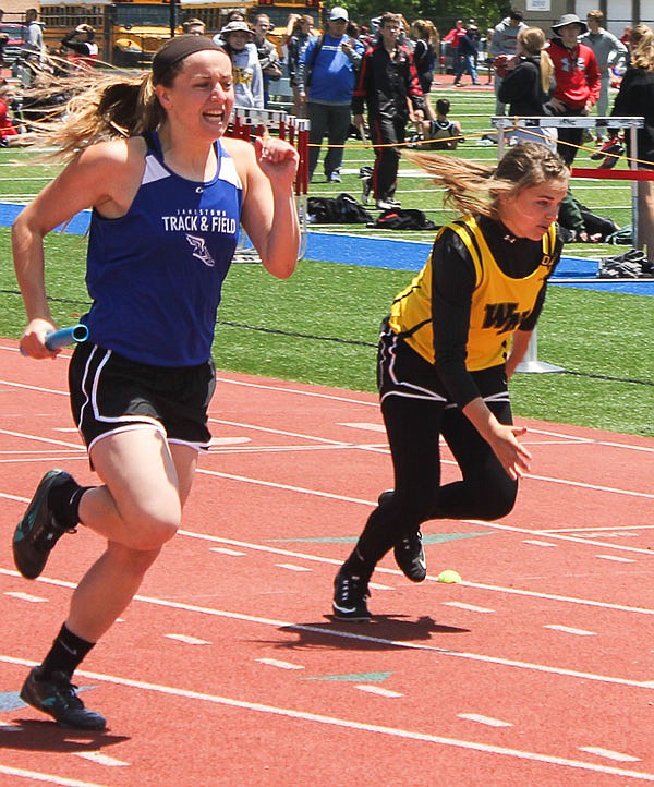 Sierra Cooper of Jamestown finishes her leg of the girls 4 x 200 Meter Relay on Saturday afternoon, May 14, 2016, at the Class 1 Sectional 3 meet in Clinton.