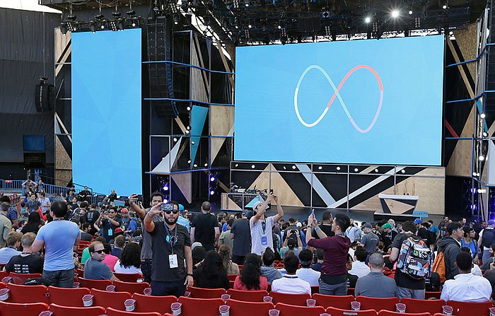 People take selfies before the start of the keynote address of the Google I/O conference Wednesday in Mountain View, California. 