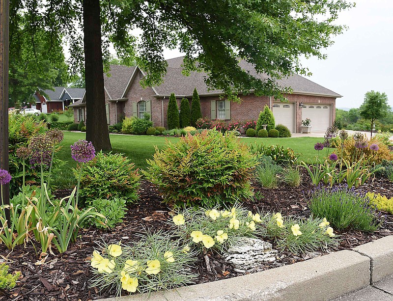 From the streetside curb to her front door, Peggy Salmons takes great pride in her yard and garden.