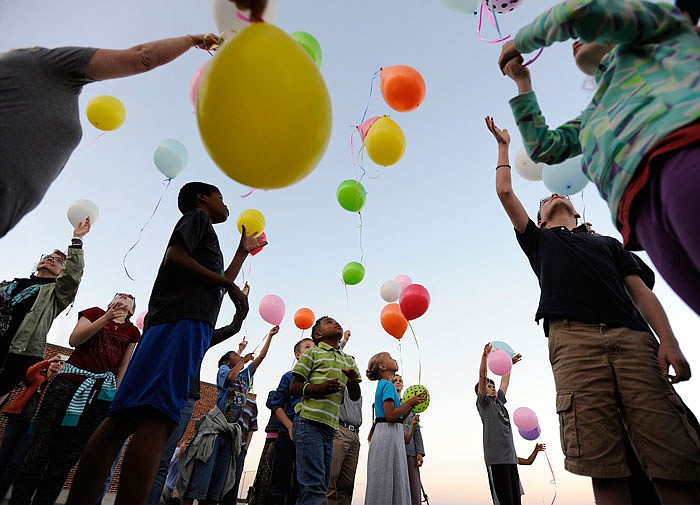 Children, foster parents and other attendees release 130 balloons into the sky May 18, 2016, each representing 100 children in Missouri's foster care system during the Central Missouri Foster Care and Adoption Association's "Light the Way" event at Thorpe Gordon Elementary School. 