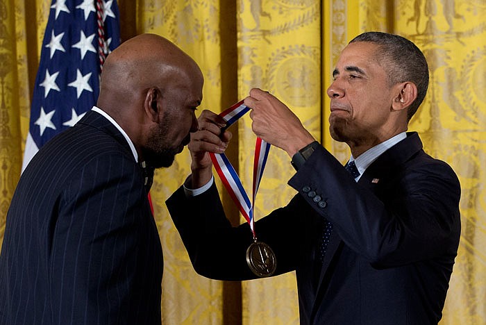 President Barack Obama awards Dr. Cato T. Laurencin, of the University of Connecticut, the National Medal of Technology and Innovation Thursday during a ceremony in the East Room of the White House.