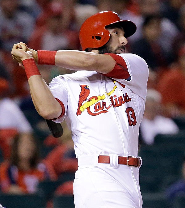 Cardinals third baseman Matt Carpenter watches his three-run home run during the eighth inning of Thursday night's game against the Rockies at Busch Stadium.