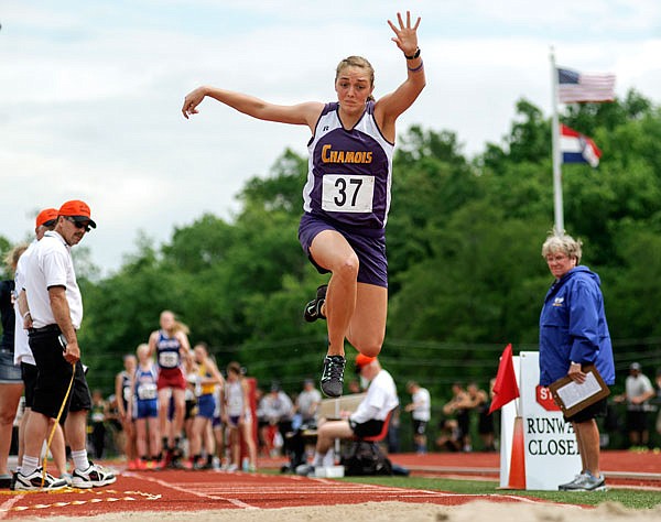 Cheyenne Hemeyer of Chamois finishes her attempt in the Class 1 girls long jump at Adkins Stadium.