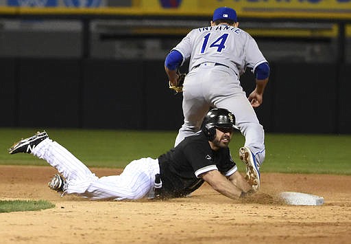 Chicago White Sox's Adam Eaton (1) is forced out into a double play at second base by Kansas City Royals second baseman Omar Infante (14) during the seventh inning of a baseball game, Friday, May 20, 2016, in Chicago. 
