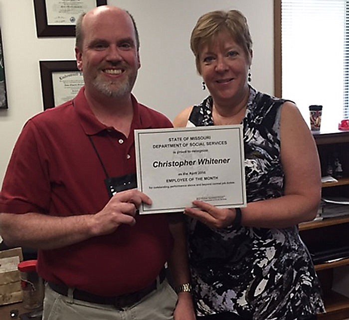 Chris Whitener, left, receives Missouri's State Employee of the Month certificate on May 19, 2016.