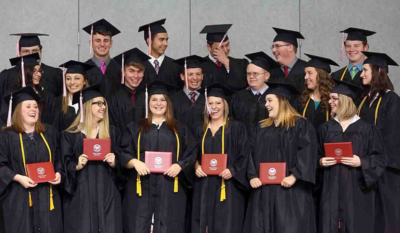 New graduates react Saturday, May 21, 2016, after turning their tassels during the Calvary Lutheran High School commencement ceremony in Jefferson City.