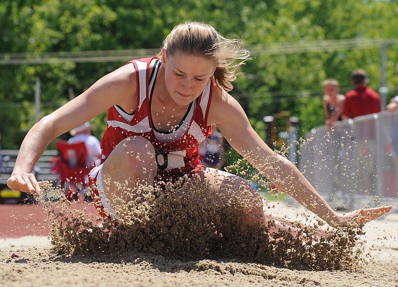 Calvary Lutheran's Samantha Gunn splashes down in the pit while competing in the Class 1 girls long jump Saturday at Adkins Stadium in Jefferson City.