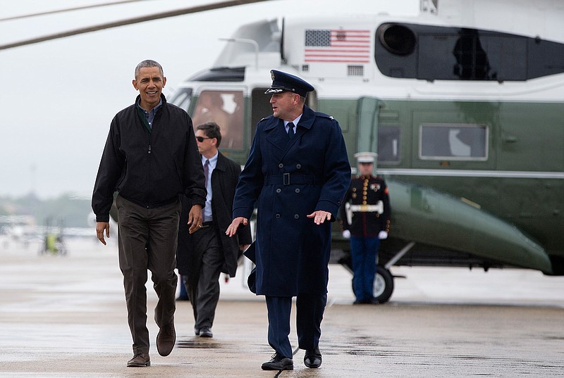 President Barack Obama walks from Marine One to board Air Force One, in Andrews Air Force Base, Md, Saturday, May 21, 2016, en route to Elmendorf Air Force Base in Anchorage, Alaska, then to Yokota Air Force Base, in Fussa, Japan, on his way to Hanoi, Vietnam. 