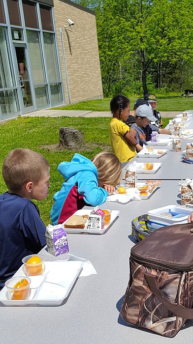 Students at Hatton-McCredie Elementary School enjoy lunch. Three school districts in Callaway County will offer free summer meals to all children under the age of 18.