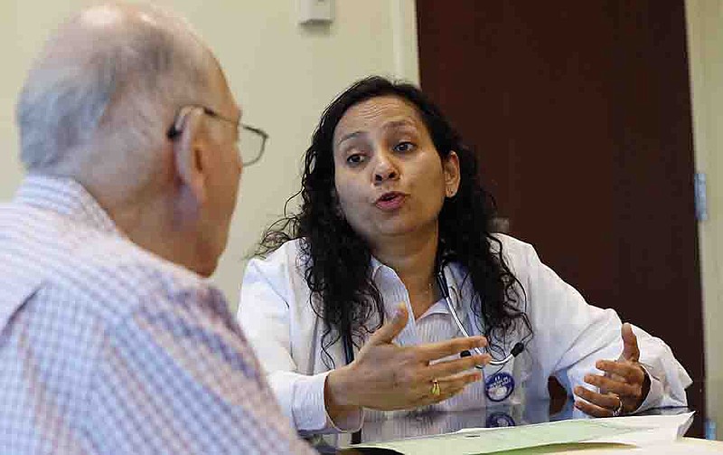Herbert Diamond, left, 88, of Fort Lee, meets with Dr. Manisha Parulekar about his end-of-life preferences at the Hackensack Medical Center in New Jersey.
