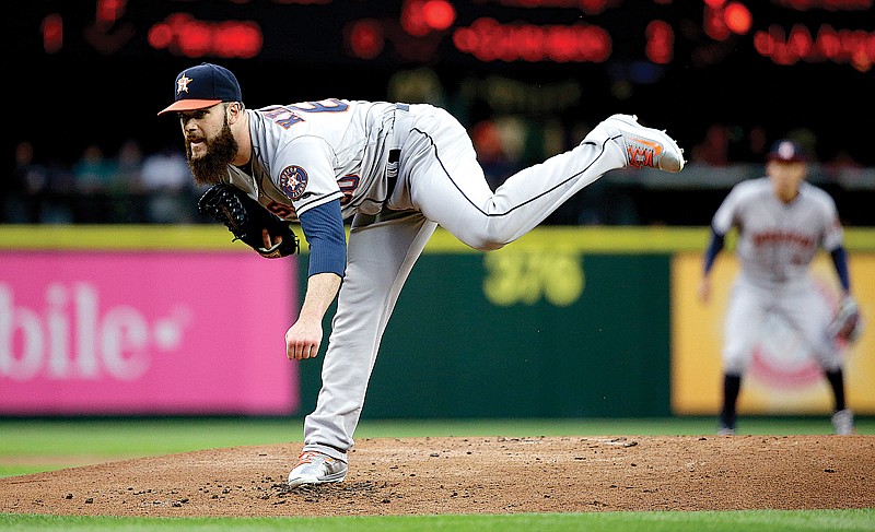 Houston Astros' Dallas Keuchel throws against the Seattle Mariners  April 26 in Seattle. Keuchel has followed up his 20-win season with a difficult start, dropping five straight decisions—his longest skid since losing seven in a row as a rookie in 2012. 