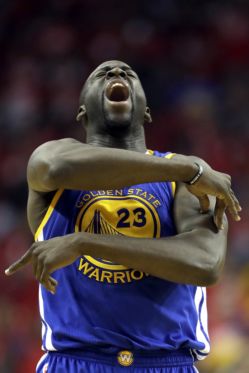 Golden State Warriors' Draymond Green celebrates after hitting a three-point shot against the Houston Rockets on April 24 in Houston.